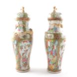 A pair of Cantonese porcelain baluster shape covered vases