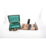 A leather manicure set by Saphir and a green leather jewel box