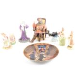 A quantity of collectable ceramic figures, including Beatrix Potter and Harry Potter