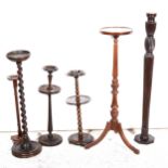 A mahogany torchere, stands, and smoker's companions