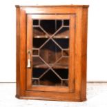 A Victorian elm hanging corner cupboard, ...