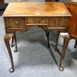 A reproduction mahogany finish lowboy