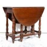 An oak gateleg table, 1930s