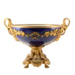 A French Bleu de Roi porcelain and gilt metal comport with twin handles