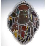 A Victorian stained and leaded glass panel, depicting a female saint