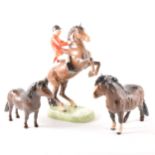 A Beswick model of Huntsman on rearing horse ...