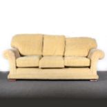 A contemporary three-seater settee, Old Gold upholstery, ...