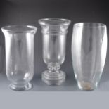 Tall glass pedestal vase, and two others