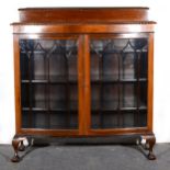 Walnut china cabinet, bowfront, slightly raised back