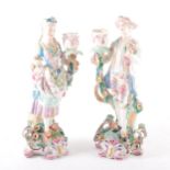 A pair of continental porcelain figural candlesticks, probably French, ...
