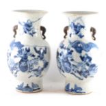 A pair of Chinese crackle glaze blue and white vases, ...