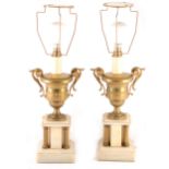 A pair of brass and onyx table lamps