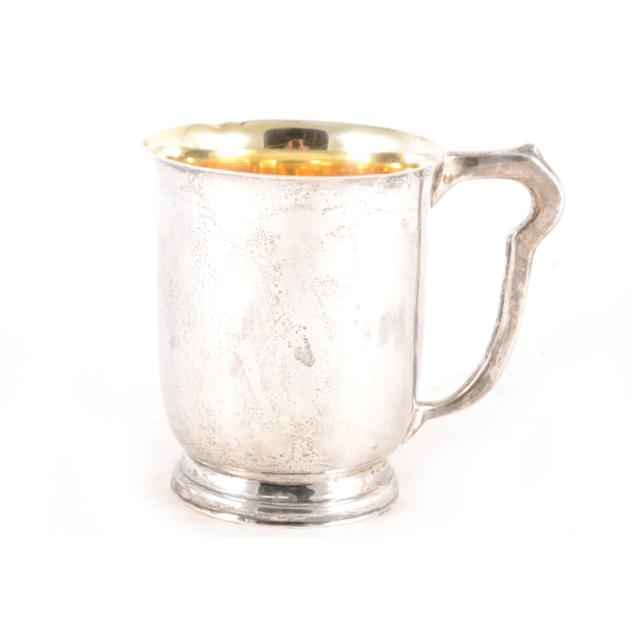 A white metal tankard marked "Sterling Silver"
