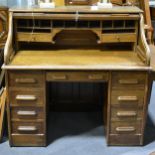 An oak roll top desk, ...