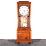 The Gledhill-Brook Time Recorders An oak cased patent clocking-in clock,