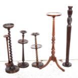 A mahogany torchere, stands, and smoker's companions