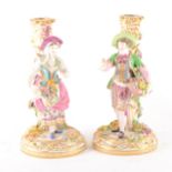A pair of English porcelain candlesticks, in the style of Stevenson & Hancock