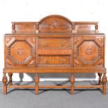 Oak sideboard, arched rose back with moulded cornice,