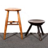 Old oak peg-leg stool with dished circular seat,