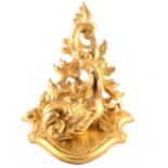 A Florentine style carved wood and gilt gesso corner wall bracket