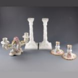 A pair of Royal Worcester plain white candlesticks, ...