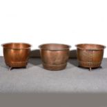 A pair of copper coppers, another, and a quantity of other fireside metalware