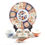 Chinese blue and white porcelain tea bowl decorated with figures, a Japanese Imari charger, etc