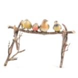 After Bergman, four cold painted birds on a branch