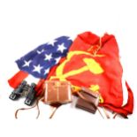 A vintage American and a Soviet flag, copper scuttle, pair of Denhill binoculars, and voltmeter.