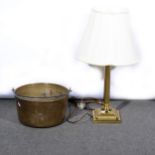 A brass jam pan and a lacquered brass table lamp.