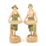 A pair of Royal Dux figures, modelled as gleaners, ...