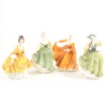 A Royal Doulton figure, Kirsty HNT381, height 20cm; another, Fair Lady HN2193; another, Coralie