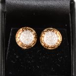 A pair of circular diamond cluster earrings in 9 carat yellow gold mounts.