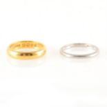 Two wedding rings, 22 carat yellow gold and platinum.