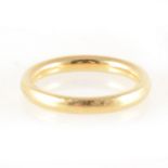 An 18 carat yellow gold wedding band.