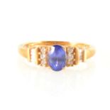 An oval tanzanite and diamond ring