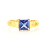 A princess cut tanzanite ring.