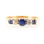 A sapphire and diamond five stone ring.