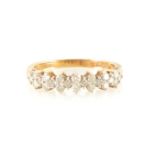 A diamond half eternity ring.