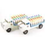 Tri-ang tin-plate trucks; four including two milk floats with milk bottle