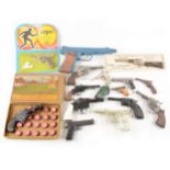 Thirteen vintage toy cap guns, and one water pistol, some cased.