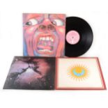 King Crimson; three vinyl LP records, In the Court of the Crimson King, Larks' Tongues in Aspic and