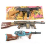 Three toy plastic and tin-plate guns, by Marx, TM and Action toys,