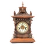 A German stained wood mantel clock, ...