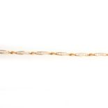 An 18 carat yellow and white gold diamond line bracelet.
