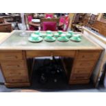 An oak twin pedestal desk, tooled leather inset, ...