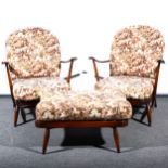 A pair of Ercol stained beechwood Windsor type easychairs, ...