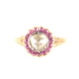 An old rose cut diamond and pink stone cluster ring.
