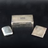 A silver cigarette box, Alfred Deeley, Birmingham 1933 and two silver cigarette cases.