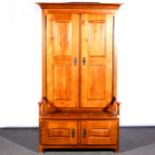 A reproduction oak hall bench / cupboard, ...